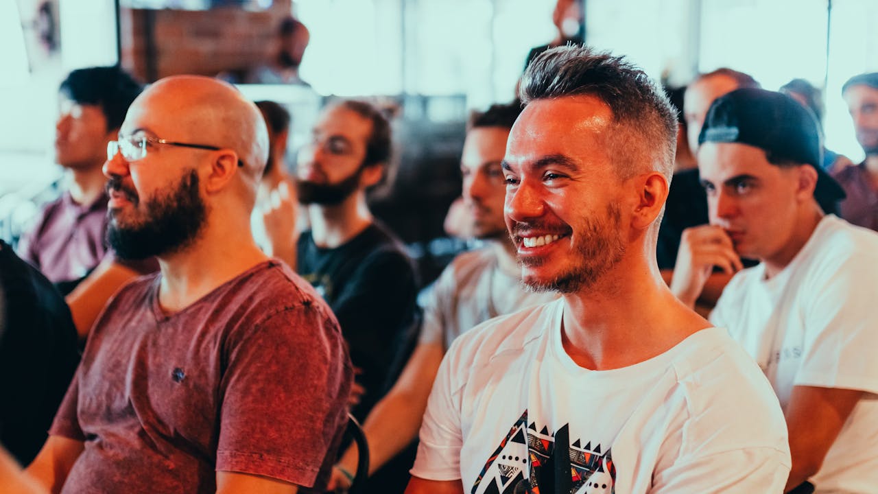 Smiling attendees actively engaged in a seminar, creating a positive atmosphere. Ideal for business and educational themes.